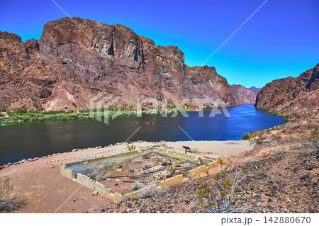 Abandoned Gauging Station Foundation Beside Colorado River in Arizona Desert Canyon Abandoned Gauging Station Foundation Beside Colorado River in Arizona Desert Canyon 142880670