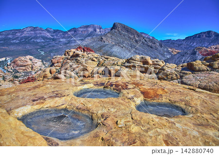 Red Rock Canyon Calico Tanks Pools and Turtlehead Peak Under Bright Blue Sky 142880740