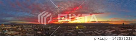Aerial Downtown Las Vegas Nevada Cityscape at Sunset with Colorful Golden Hour Sky 142881038