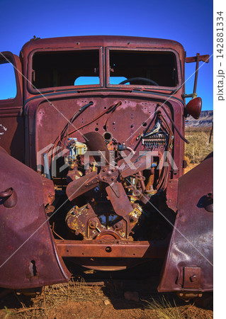 Abandoned Vintage Truck Engine Close Up in Arizona Desert Under Clear Blue Sky 142881334