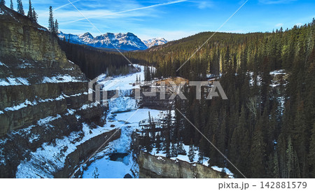Aerial Frozen Waterfall and Canyon Crescent Falls in Winter Forest Alberta 142881579