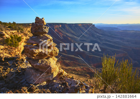 Rock Stack Cairn and Desert Vegetation at Grand Canyon Overlook Arizona Rock Stack Cairn and Desert Vegetation at Grand Canyon Overlook Arizona 142881664