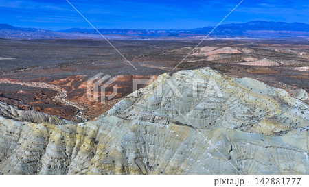 Aerial Arizona Strip Desert Landscape With Rugged Hills and Distant Mountain Ranges Aerial Arizona Strip Desert Landscape With Rugged Hills and Distant Mountain Ranges 142881777