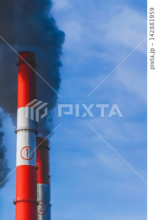Environmental problem smoke pipe industrial plant thermal power plant blue sky environmental pollution chimney Environmental problem smoke pipe industrial plant thermal power plant blue sky environmental pollution chimney 142881959