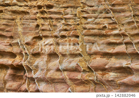 Rugged Rock Texture Close Up With Layered Pattern And Warm Earth Tones Rugged Rock Texture Close Up With Layered Pattern And Warm Earth Tones 142882046
