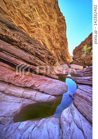 Anniversary Narrows Slot Canyon Water Pools and Sunlit Rock Formations in Nevada Anniversary Narrows Slot Canyon Water Pools and Sunlit Rock Formations in Nevada 142882402