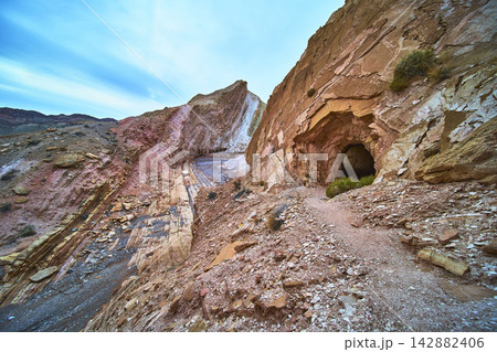 Anniversary Mine Tunnel and Dramatic Rock Formations in Nevada Desert Landscape 142882406