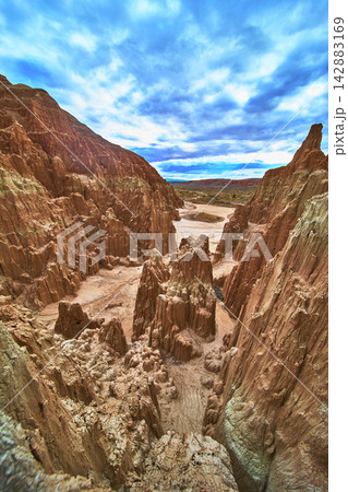 Cathedral Gorge State Park Dramatic Slot Canyon Formations and Expansive Cloudy Sky 142883169