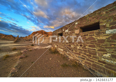 Abandoned Stone Building and Dramatic Cliffs at Cathedral Gorge State Park Nevada 142883177