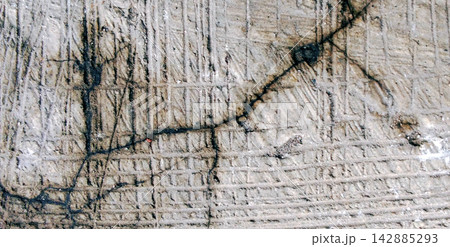 Textured Concrete Surface with Crack and Grooves 142885293