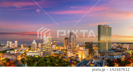 Coastal cityscape of St Petersburg, Florida, USA. Illuminated downtown area with modern architecture and scenic views of urban infrastructure in evening. Coastal cityscape of St Petersburg, Florida, USA. Illuminated downtown area with modern architecture and scenic views of urban infrastructure in evening. 142887612
