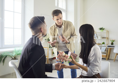 Love triangle conflict with jealous man interrupting dramatic romantic proposal 142887904