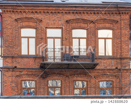 Four windows of the old mansion 19 century with brown bricks wall Four windows of the old mansion 19 century with brown bricks wall 142888620