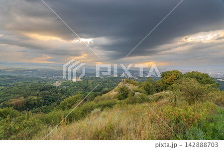 View of the mountains and Kislovodsk from the observation decks of the Kislovodsk Park. Evening sunset over the mountains of Kislovodsk. 142888703