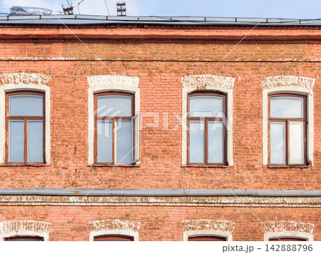 Four windows of the old mansion 19 century with brown bricks wall Four windows of the old mansion 19 century with brown bricks wall 142888796