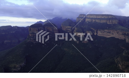 Aerial view of a rugged mountain plateau above dense forest Aerial view of a rugged mountain plateau above dense forest 142890718