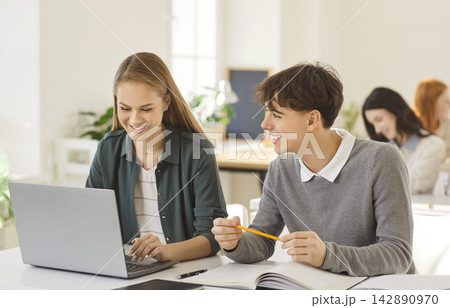 Students Studying Together With Laptop In School Students Studying Together With Laptop In School 142890970