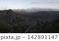 Tranquil Scene Featuring Vast Canyon With Stratified Formations Bathed In Warm Sunset Glow From Drone View. Creative 142891147