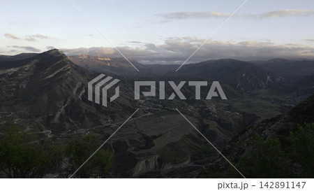 Tranquil Scene Featuring Vast Canyon With Stratified Formations Bathed In Warm Sunset Glow From Drone View. Creative 142891147