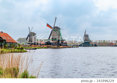 Windmills in Zaanse Schans, a district of Zaandam, Netherlands 142896229