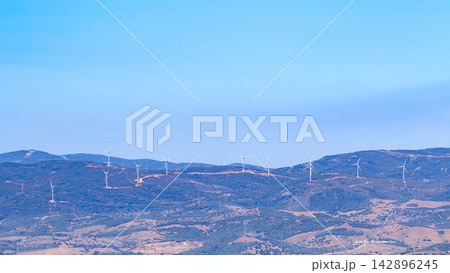 Wind farm or wind park - An area with a group of wind turbines Wind farm or wind park - An area with a group of wind turbines 142896245