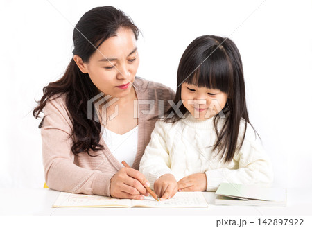 Asian Mother and Daughter Laughing Together While Studying Asian Mother and Daughter Laughing Together While Studying 142897922