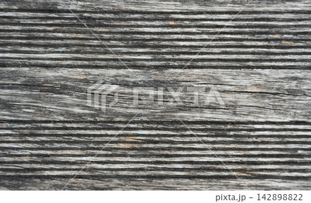 Old gray wood background, embossed, textured rustic plank surface. Old gray wood background, embossed, textured rustic plank surface. 142898822