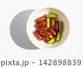 Brown gel pills, dark red capsules close up 142898839