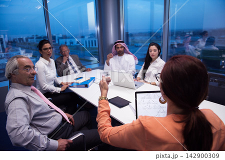 Middle Eastern and multicultural business team in a corporate office meeting discussing strategy and collaboration 142900309