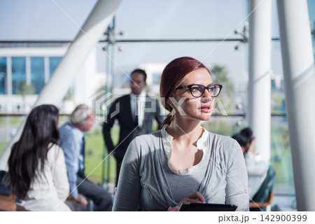 Middle Eastern businesswoman looking thoughtful during a startup meeting in a modern open corporate office 142900399
