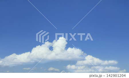 City sky with light cirrus clouds and sunlight. Natural background and texture. City sky with light cirrus clouds and sunlight. Natural background and texture. 142901204