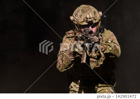 Tactical Soldier Aiming Rifle In Camouflage During Military Training Exercise With Night Vision Tactical Soldier Aiming Rifle In Camouflage During Military Training Exercise With Night Vision 142901472