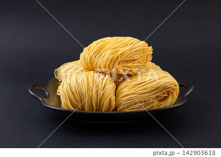 assorted Colored Dried Cantonese Jook Sing Noodle Cakes 142903618