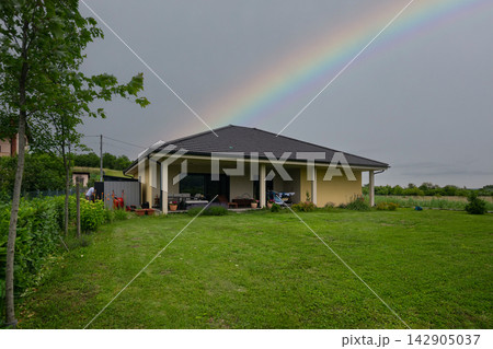 Modern modular home with minimalist design, low-energy features and a rainbow over the backyard 142905037