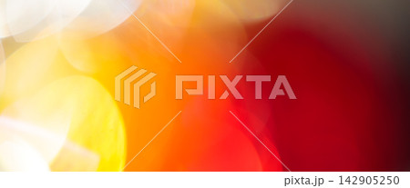 Abstract blurred background with overlapping golden bokeh and a deep red gradient Abstract blurred background with overlapping golden bokeh and a deep red gradient 142905250