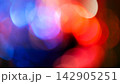 Abstract blurred bokeh background with soft red and blue circles and white highlights 142905251