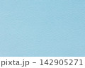 Light blue paper texture background with fine grain on a blank matte surface 142905271