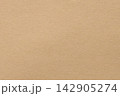 Warm beige paper background with fine grain texture on a blank matte surface in a tan color 142905274