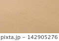 Beige paper texture background with fine grain across a blank matte surface in a warm tan color 142905276