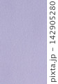 Pastel lavender paper background with fine grain texture covering a blank matte purple surface 142905280