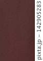 Reddish brown paper background with a fine fibrous surface in muted matte monochrome color 142905283