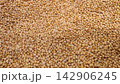 Close up background texture of uncooked organic dry red lentils grains 142906245