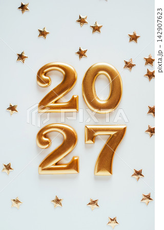 Metal numbers 2027 on a white table. Happy New Year 2026 is coming concept. Metal numbers 2027 on a white table. Happy New Year 2026 is coming concept. 142907623