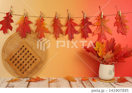 Creative autumn composition and banner for display. Empty modern elegant product display table with maple leaves on kitchen background, minimalist autumn concept. Happy Thanksgiving greeting card. Creative autumn composition and banner for display. Empty modern elegant product display table with maple leaves on kitchen background, minimalist autumn concept. Happy Thanksgiving greeting card. 142907895