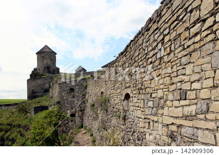 Ancient stone fortification wall and tower of Kamianets-Podilskyi castle. Ancient stone fortification wall and tower of Kamianets-Podilskyi castle. 142909306