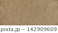 Textured stucco wall surface background with abstract pattern 142909609