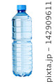 Plastic water bottle with blue cap providing hydration 142909611