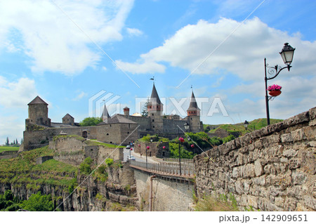 Beautiful view of Kamianets-Podilskyi castle and old bridge on a sunny day. Beautiful view of Kamianets-Podilskyi castle and old bridge on a sunny day. 142909651