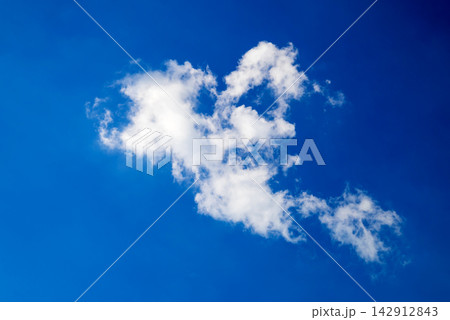 lonely white cloud in center of blue sky lonely white cloud in center of blue sky 142912843