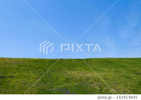 Landscape of Clear Blue Sky Meeting Green Grassy Hill Landscape of Clear Blue Sky Meeting Green Grassy Hill 142913645
